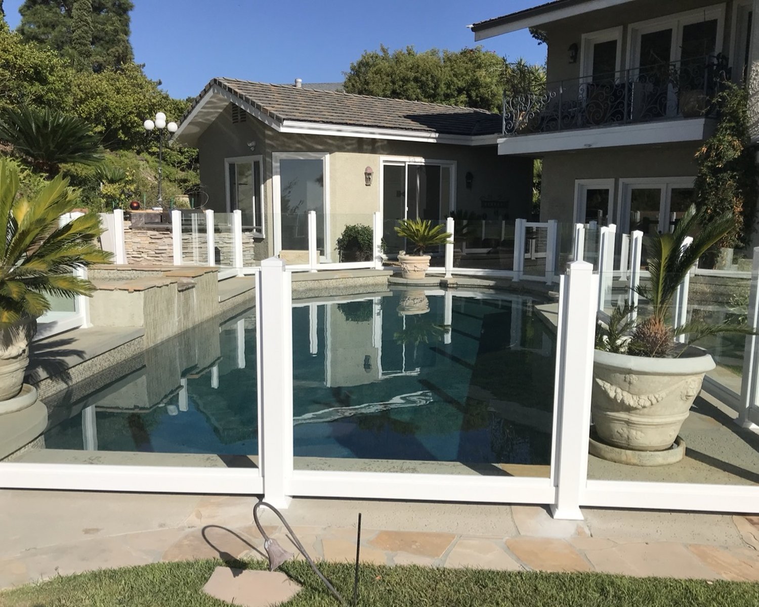 White vinyl and glass pool fence panels